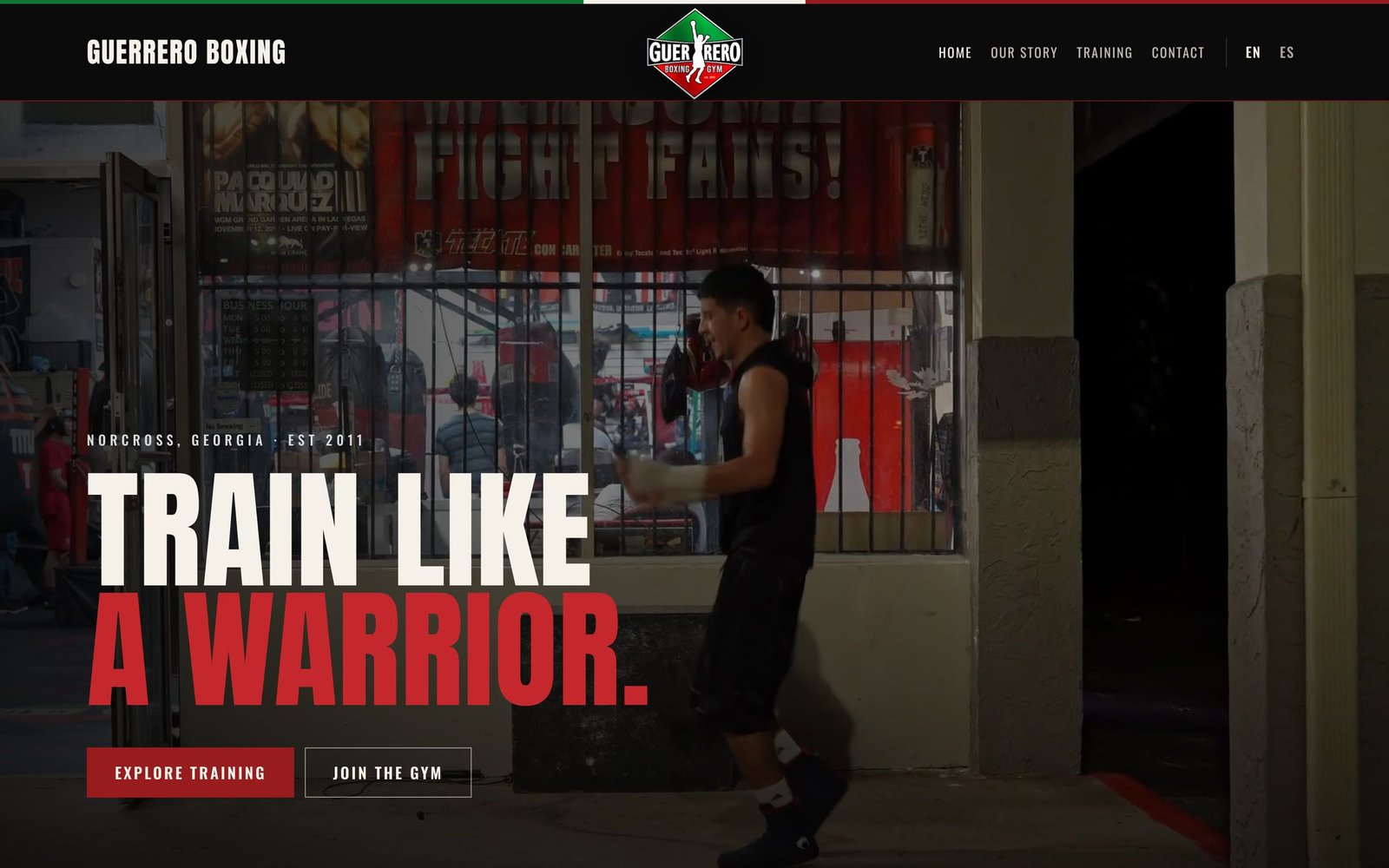Guerrero Boxing Gym homepage hero on black with the headline “Train like a warrior.” in white and red.